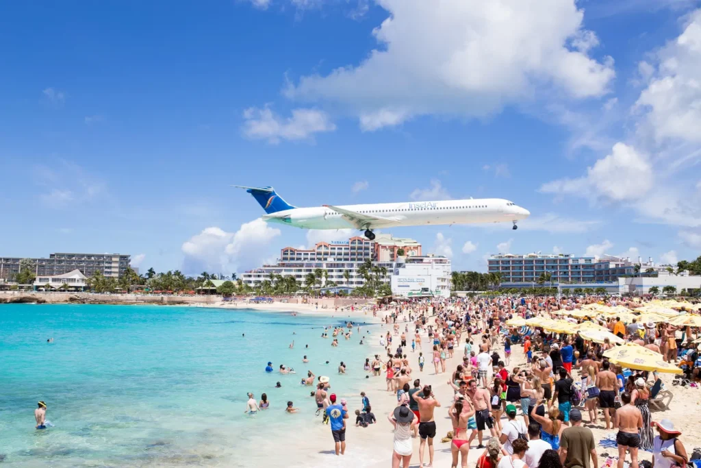 Plane landing over Maho Beach, a famous highlight near St Maarten boat tours