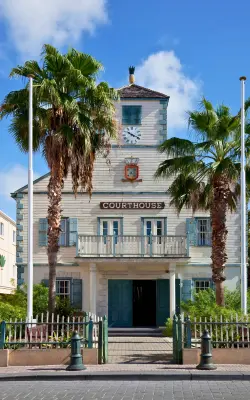 Historic Philipsburg Courthouse framed by palm trees in St Maarten