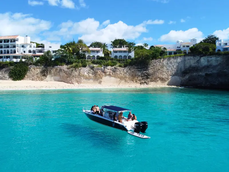 Boat charter in Anguilla with guests snorkeling in clear blue water