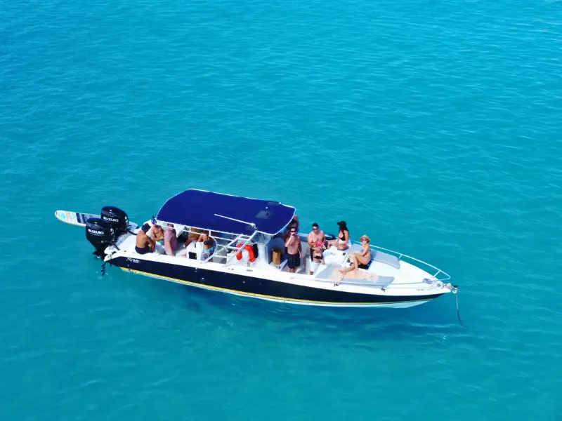 Private St Maarten boat charter with guests sunbathing on deck
