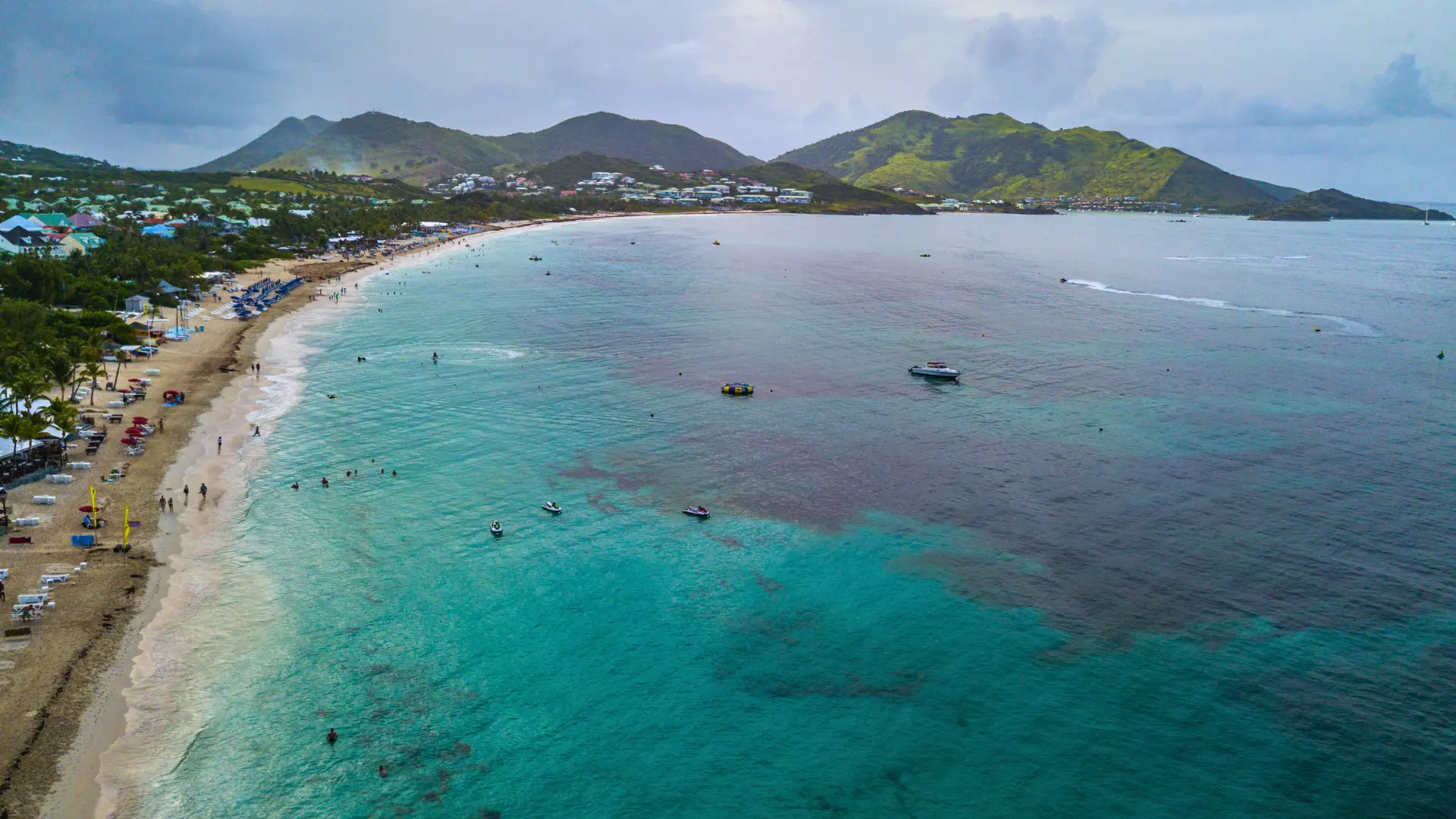 Orient Beach St Martin aerial view with turquoise waters and beach clubs