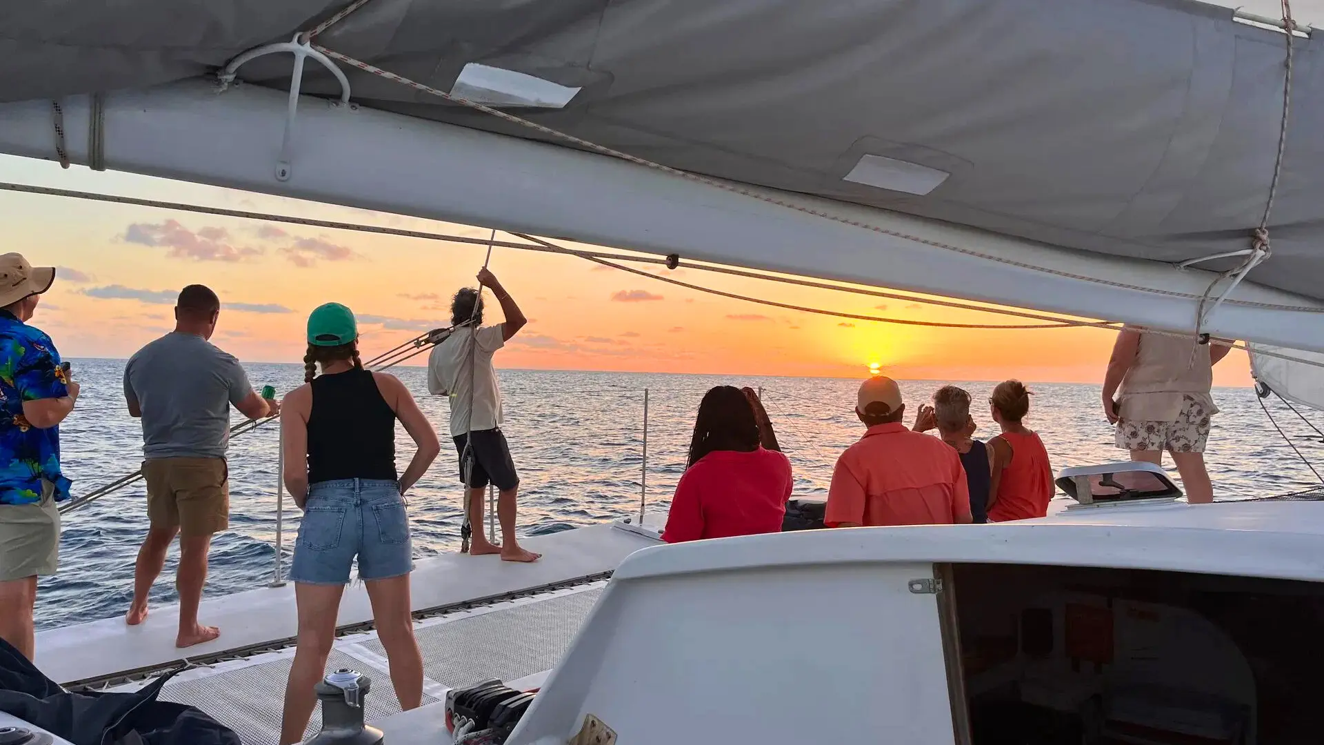 Guests marvel at glorious sunset onboard trimaran private charter SXM