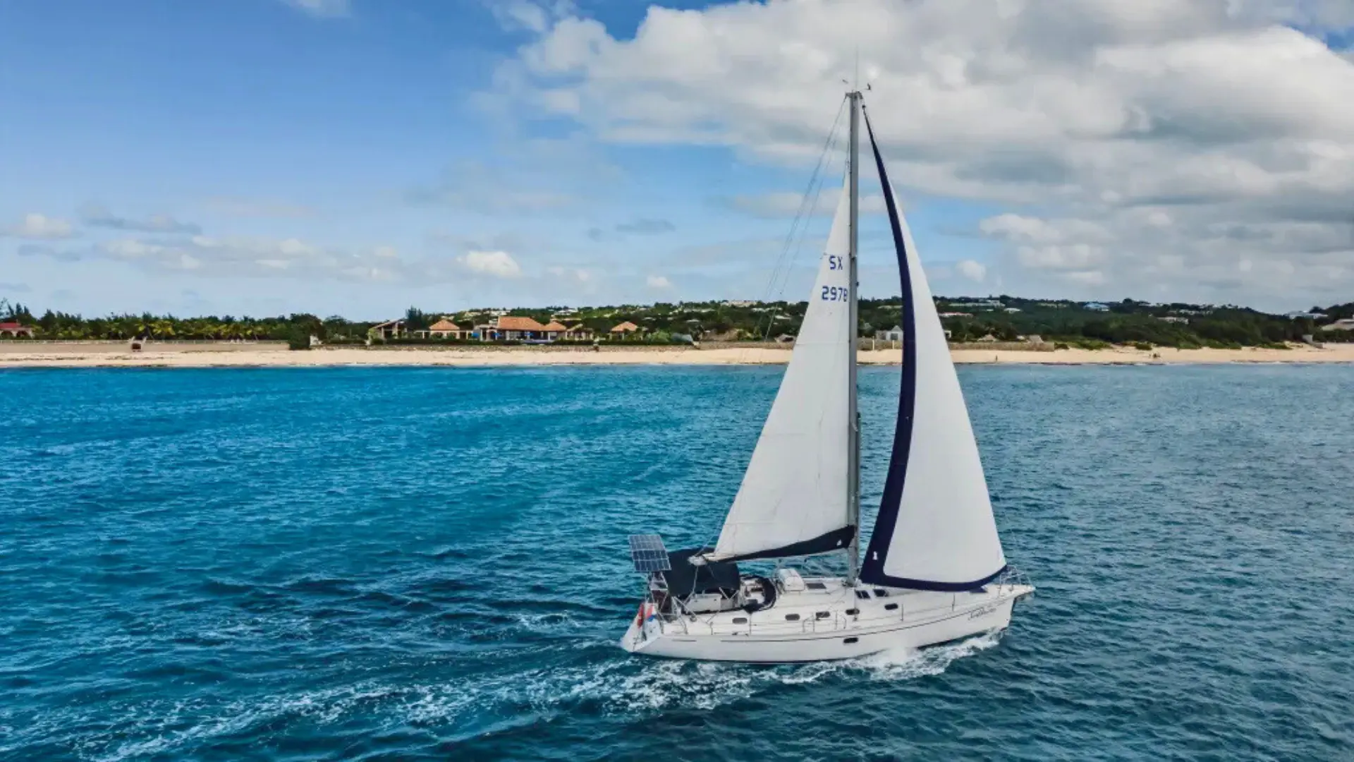 Private sailboat charter cruising along the St Maarten coastline