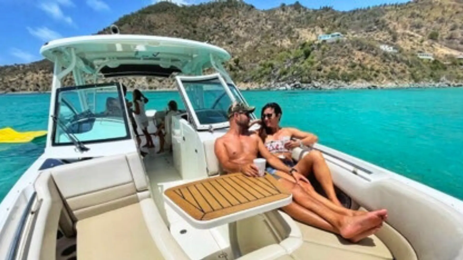 Couple enjoying a calm and relaxing private boat trip in St Maarten’s turquoise waters