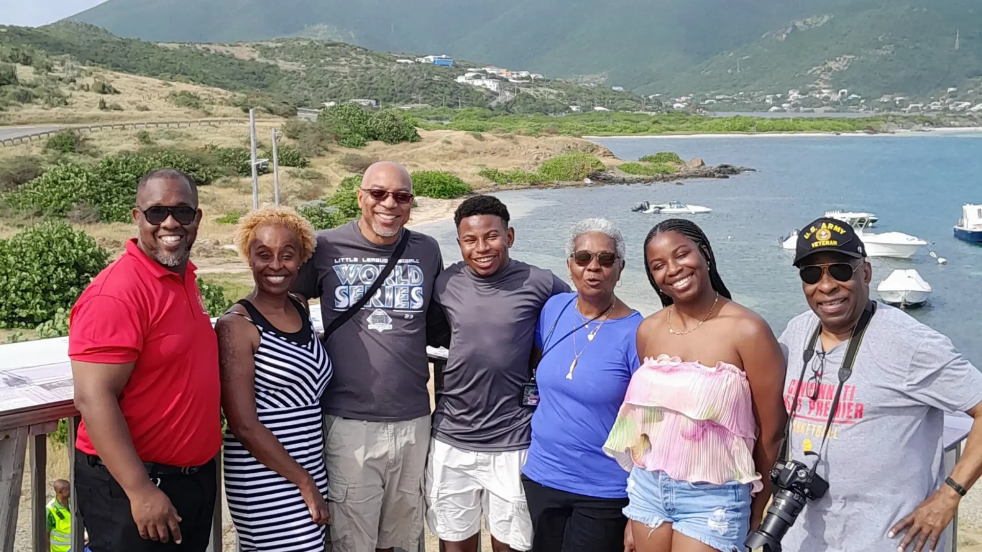 Smiling family group at coastal viewpoint during a guided island tour in St Maarten