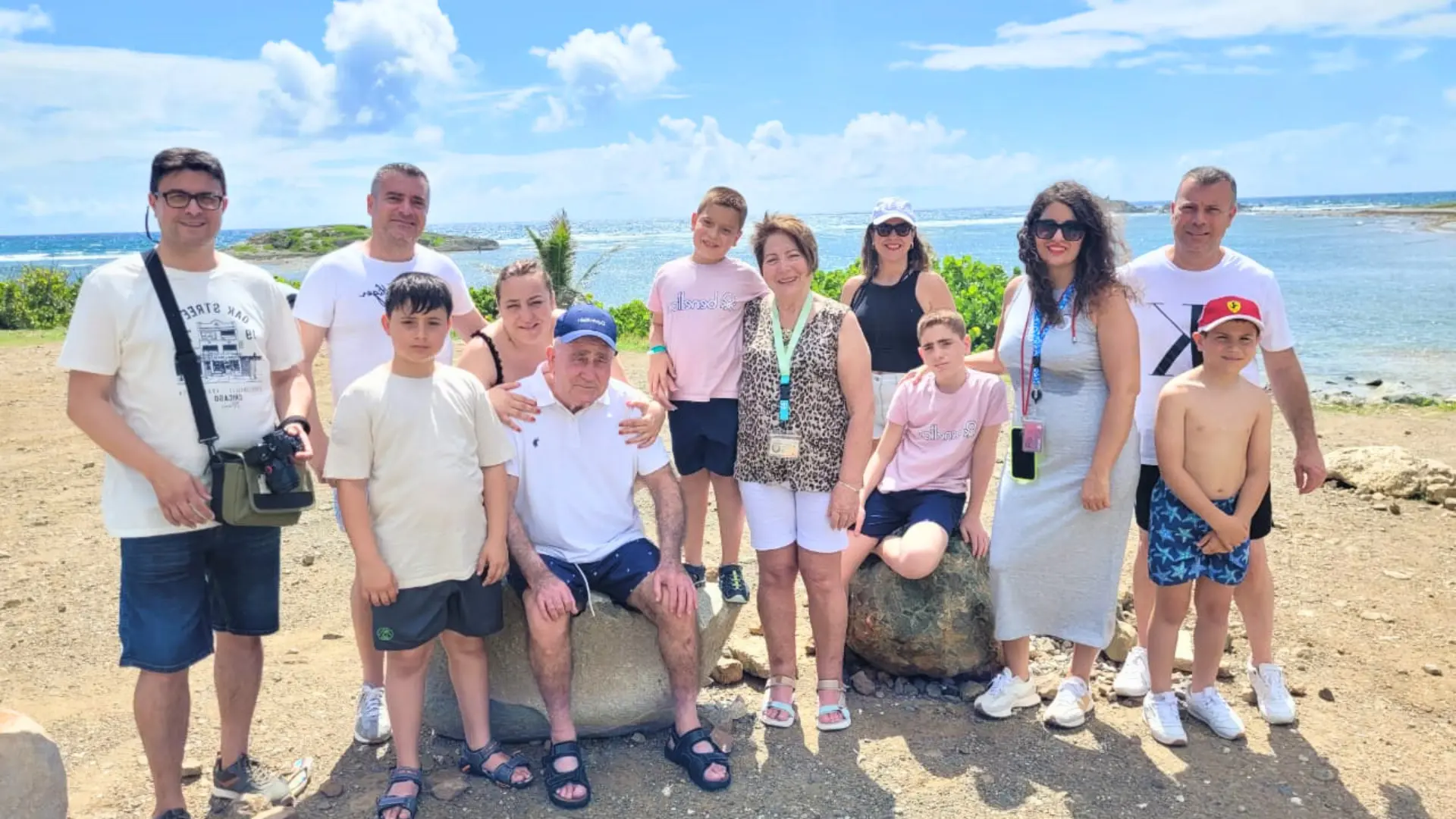 Multigenerational family posing at a coastal viewpoint on a St Maarten island tour