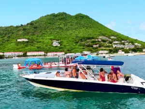 35-foot private powerboat charter moored near Grand Case, St Martin with passengers relaxing onboard