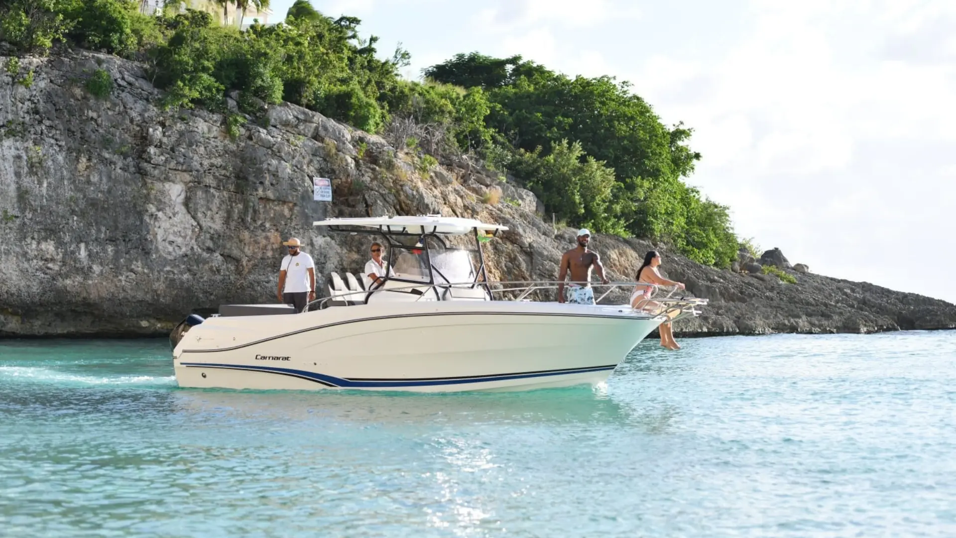 Two guests relaxing on a private boat at sunset near St Martin