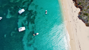 aerial view of Tintamarre island with boats and beach