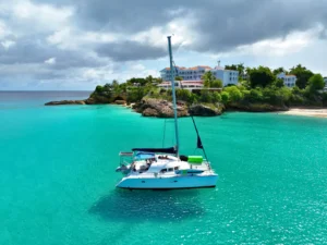 Private catamaran charter in St Martin with guests relaxing on deck