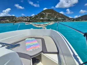 View from the bow of a private boat charter overlooking turquoise waters in St Martin
