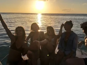 Group enjoying a sunset cruise on a private boat charter in St Martin