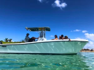 Shallow-water view of a private motorboat anchored in crystal clear turquoise sea in St Maarten