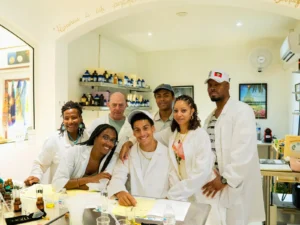 Group of participants wearing lab coats during a creative perfume workshop in St Martin