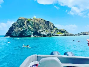 Rocky coastal landmark viewed from a private boat during a St Martin island charter