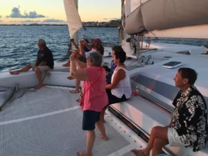 Guests enjoying sunset sailing on a trimaran in St Maarten