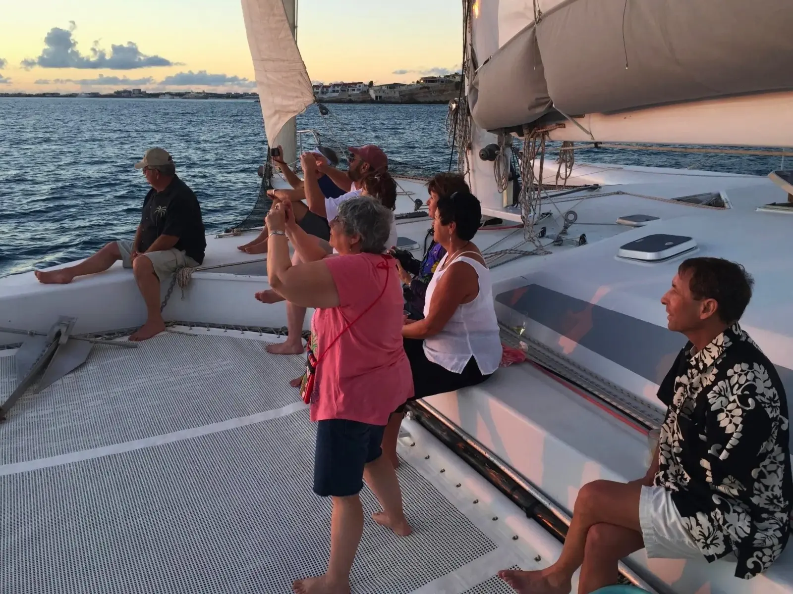 Guests enjoying sunset sailing on a trimaran in St Maarten