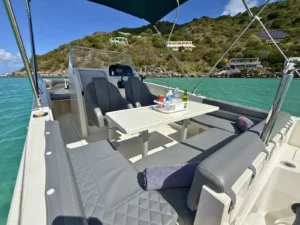 Comfortable shaded seating area on private powerboat charter in St Maarten with onboard drinks setup