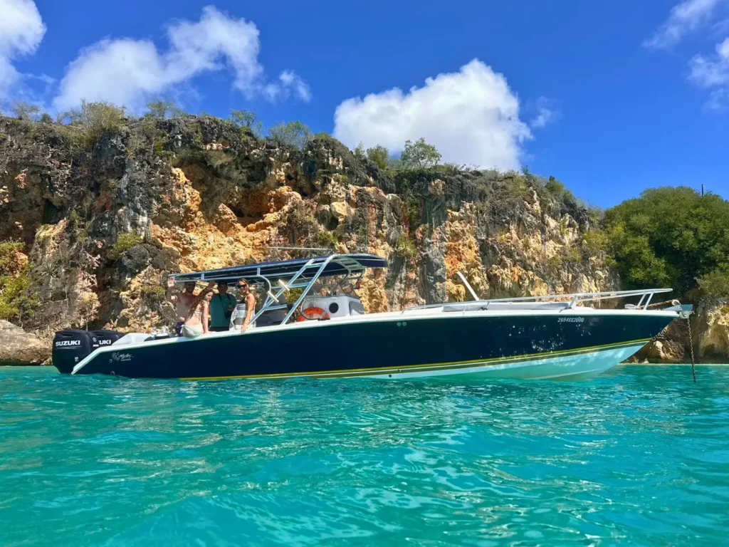 35ft Malargo private boat charter with guests in turquoise water St Martin