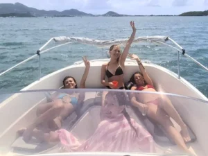 Guests relaxing on the front deck of a private boat charter in Saint Martin