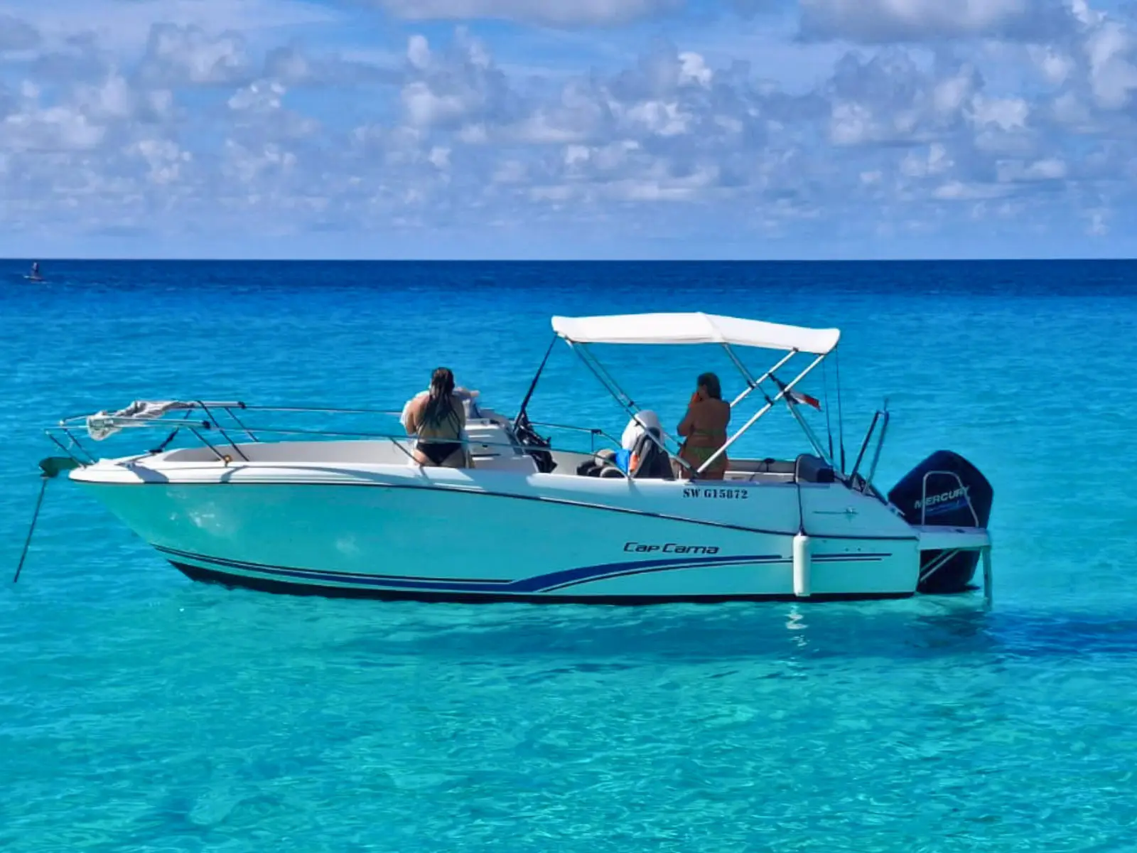 Cap Camarat private motorboat anchored in shallow turquoise water in Saint Martin