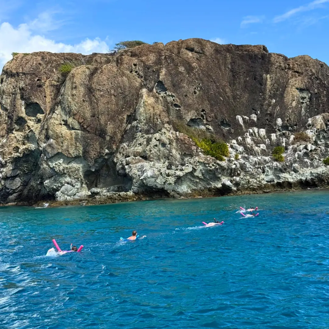 Guests snorkeling during a private boat trip along the St Martin coastline
