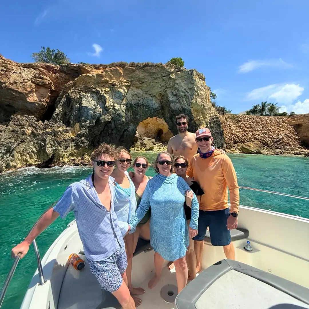 Private boat charter guests exploring the coastline of St Martin