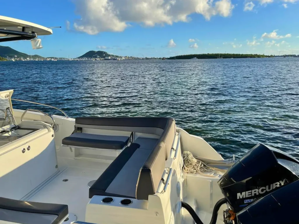 Rear seating area on private boat charter with Mercury engine St Maarten lagoon view