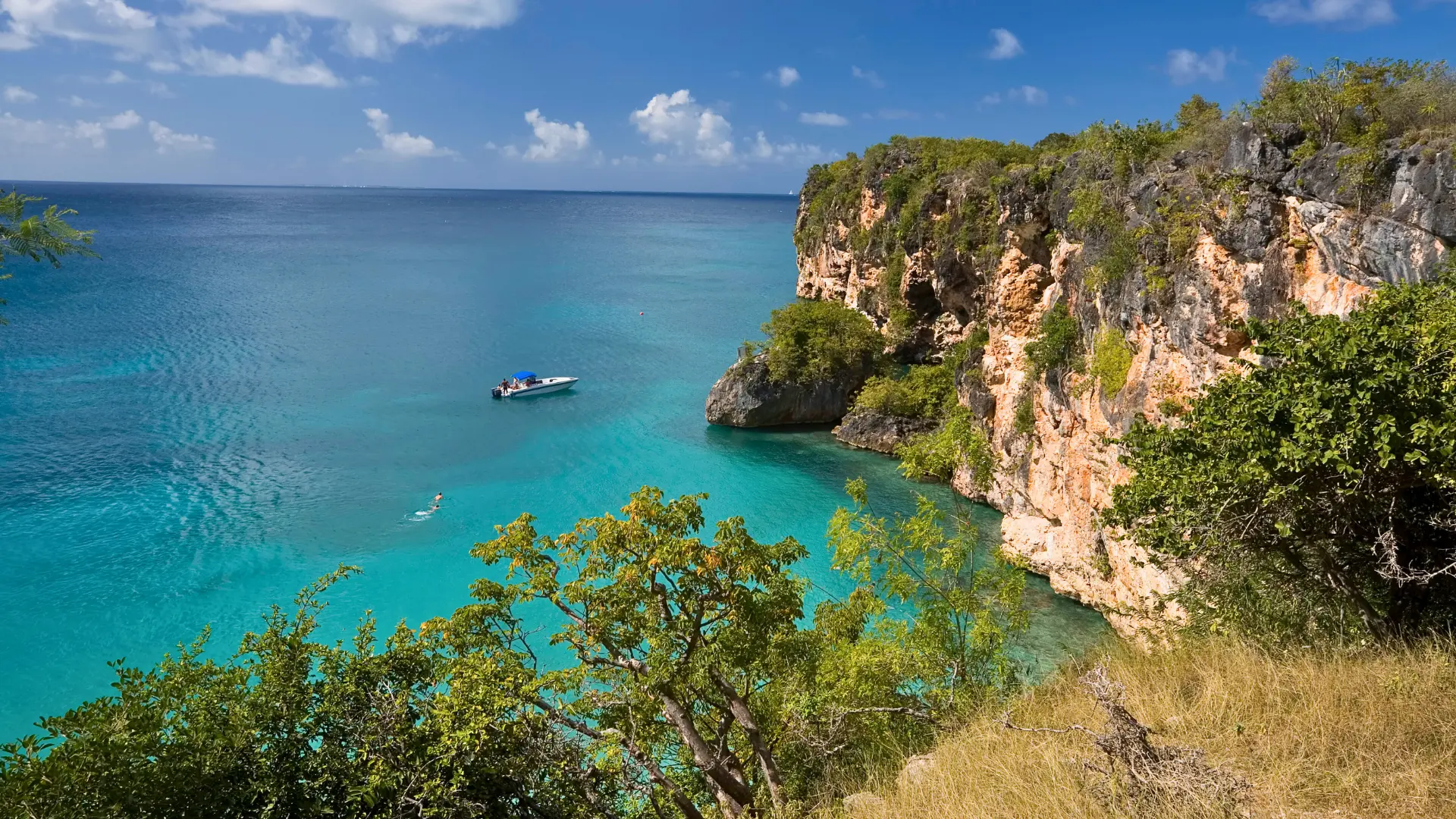 Private boat transfer from St Martin to Anguilla arriving in clear turquoise water