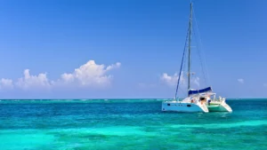 Catamaran anchored in clear turquoise water in St Martin