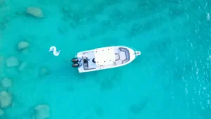 Aerial view of private boat charter in Anguilla with clear turquoise water