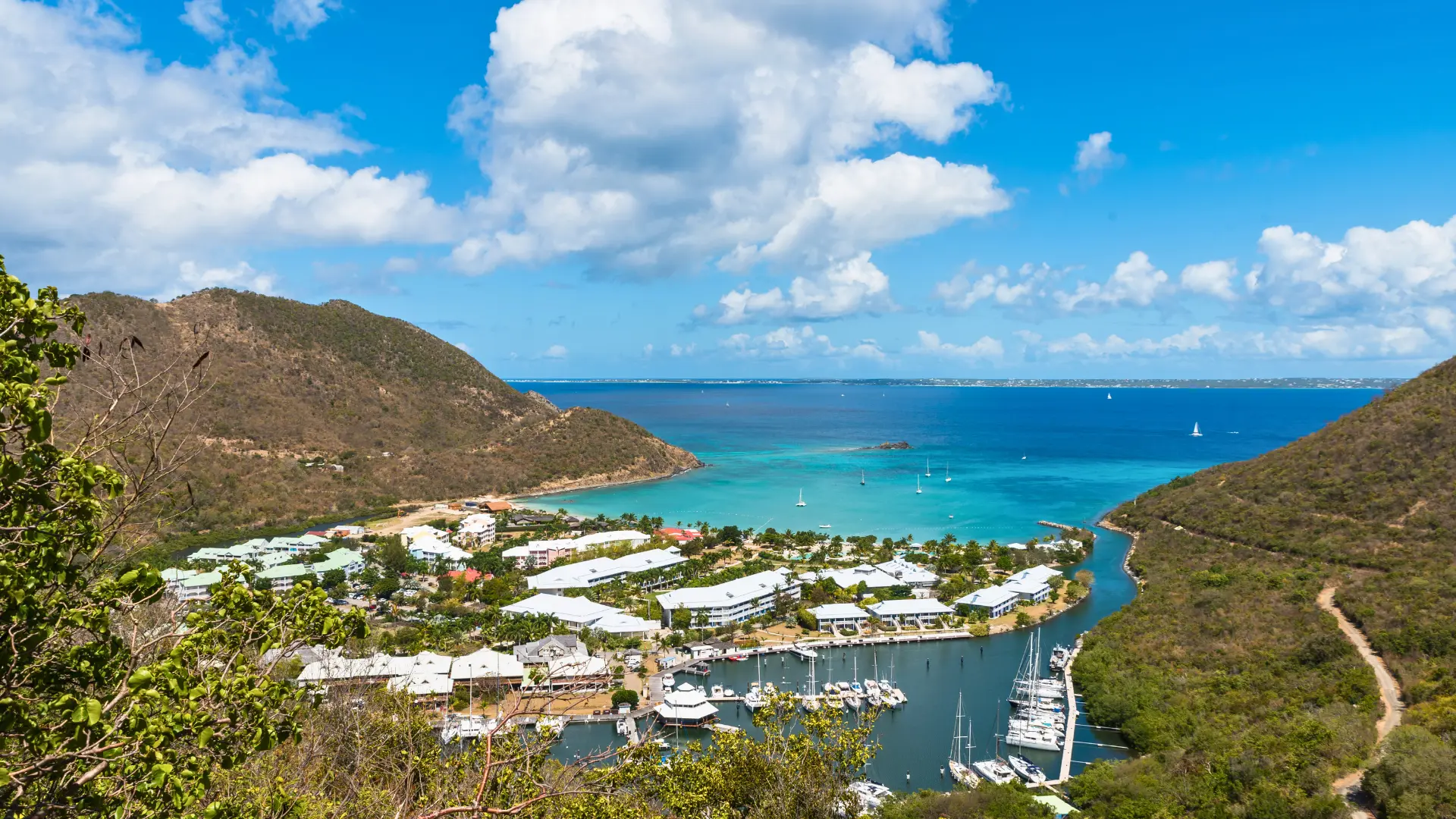 Anse Marcel beach and bay with boats in clear water St Martin