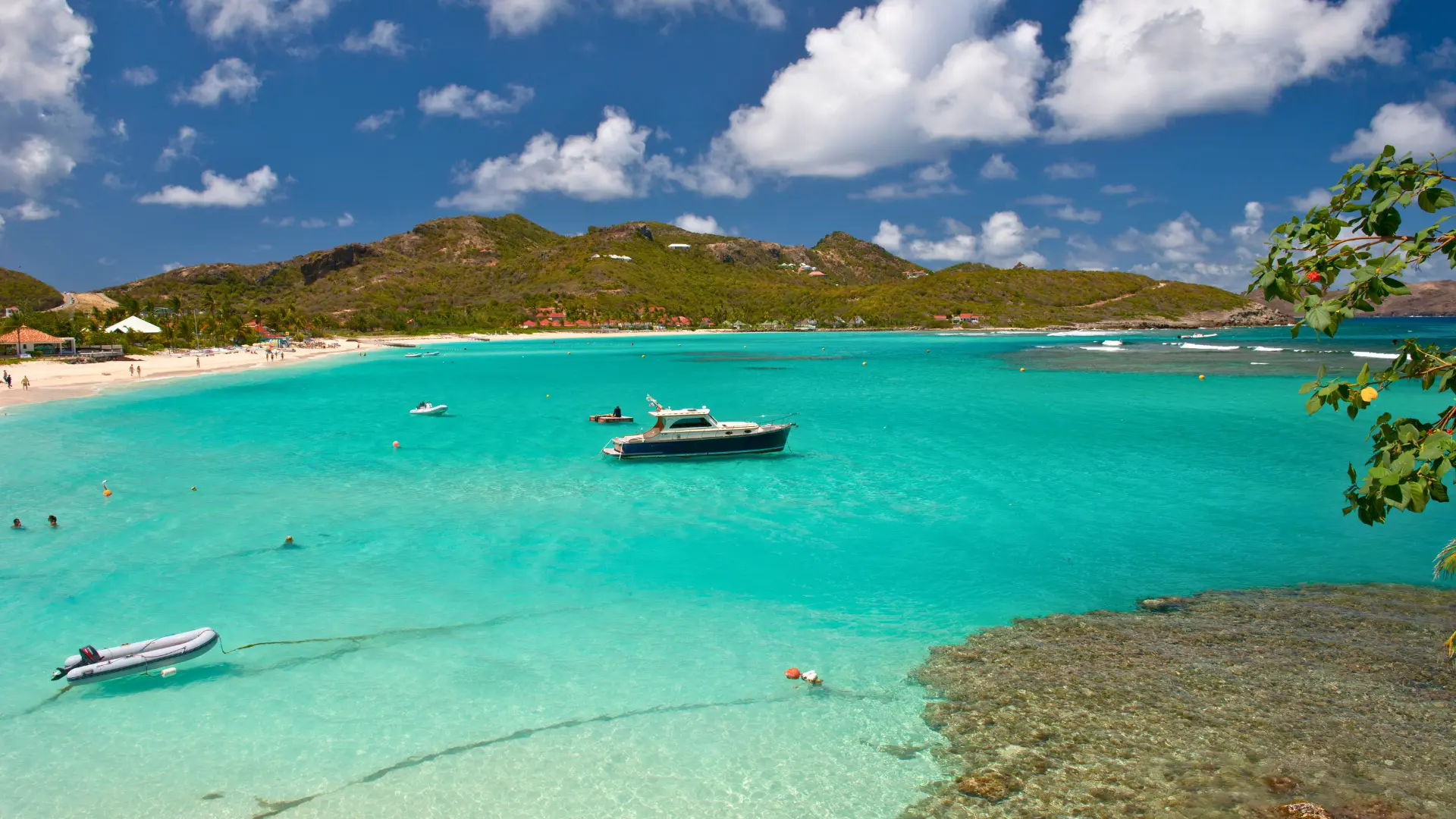 Private boats anchored in a turquoise bay in St Barts