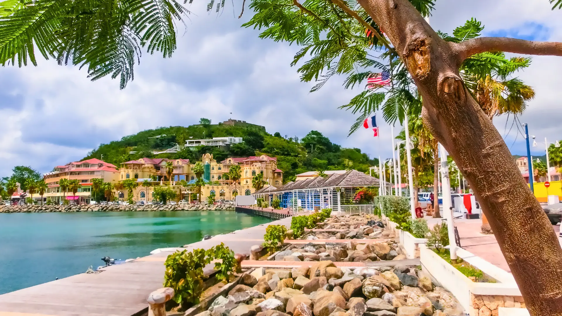 Marigot waterfront with French flags and harbour in St Martin