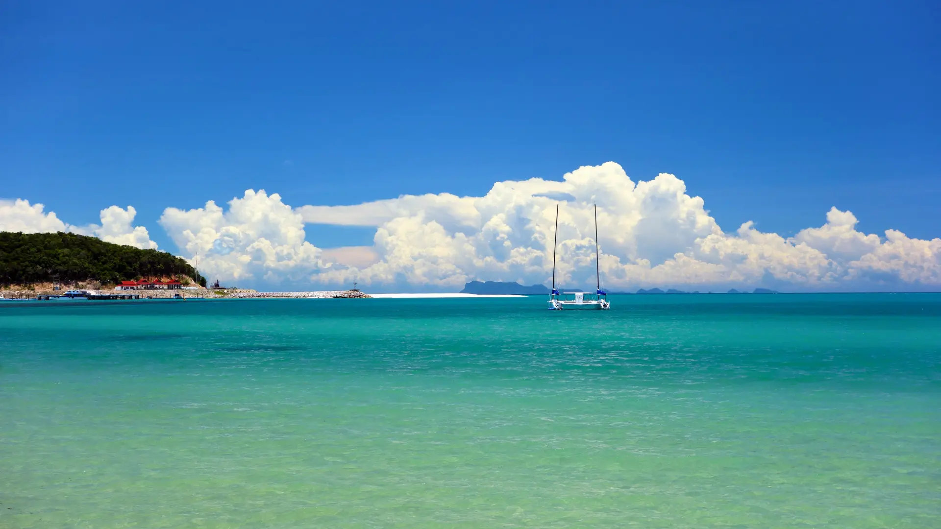 Catamaran sailing off the coast of St Barts on a calm day