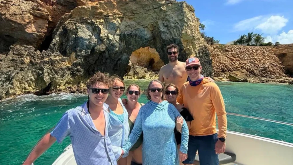 Private boat excursion in St Maarten with small group enjoying coastal views and snorkeling stop