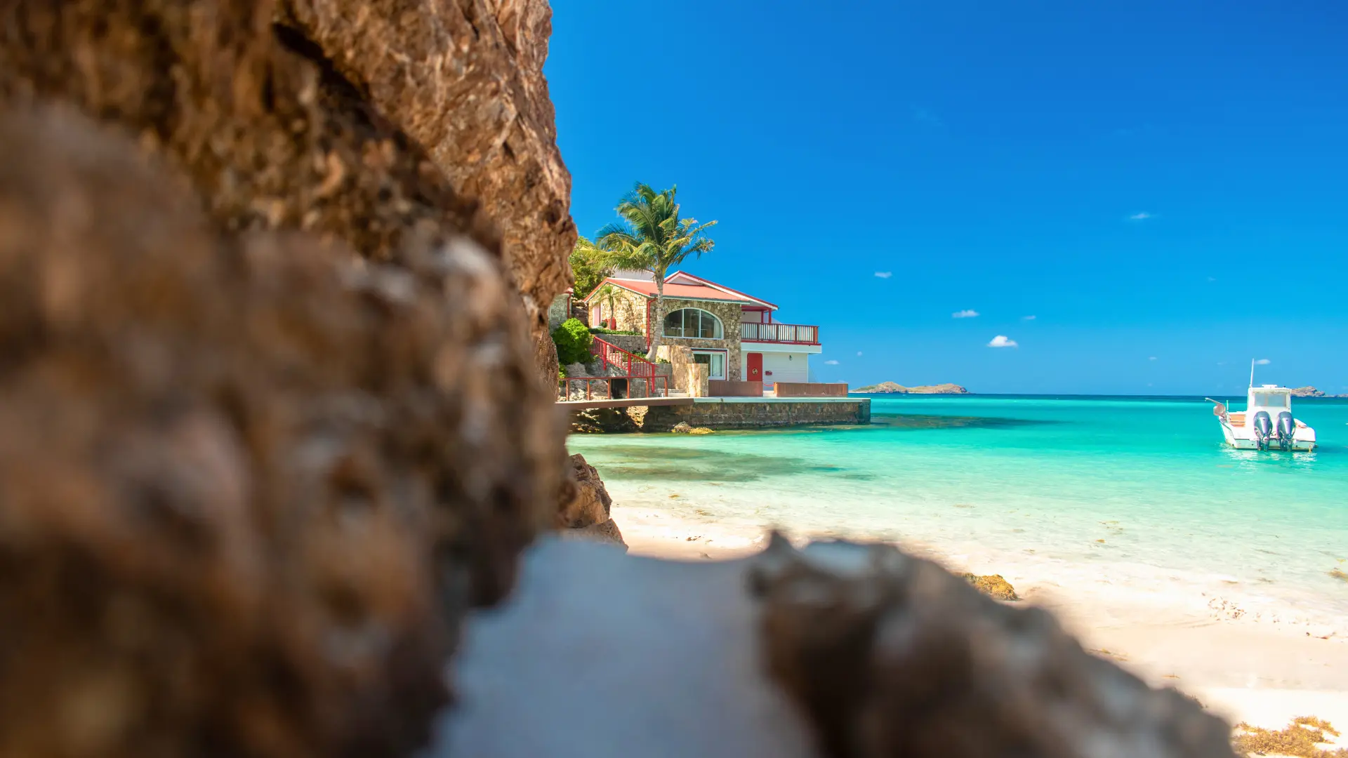 St Barts coastline with beachfront villa and clear turquoise water
