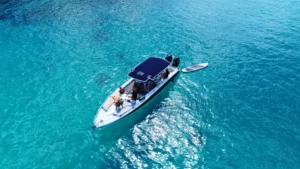 Private boat charter in St Maarten with guests relaxing onboard in clear turquoise water