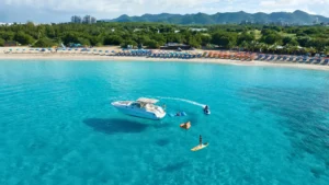 Private motorboat anchored in calm turquoise water near Mullet Bay in St Maarten