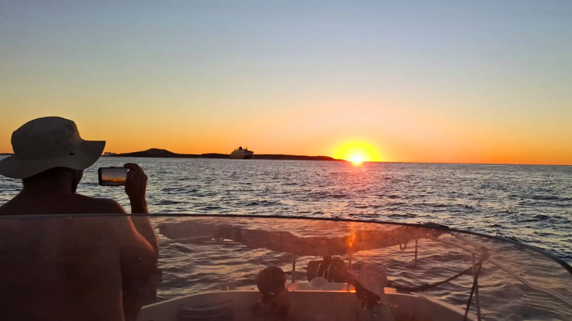 Guests enjoying a private sunset boat charter in St Maarten on calm sea
