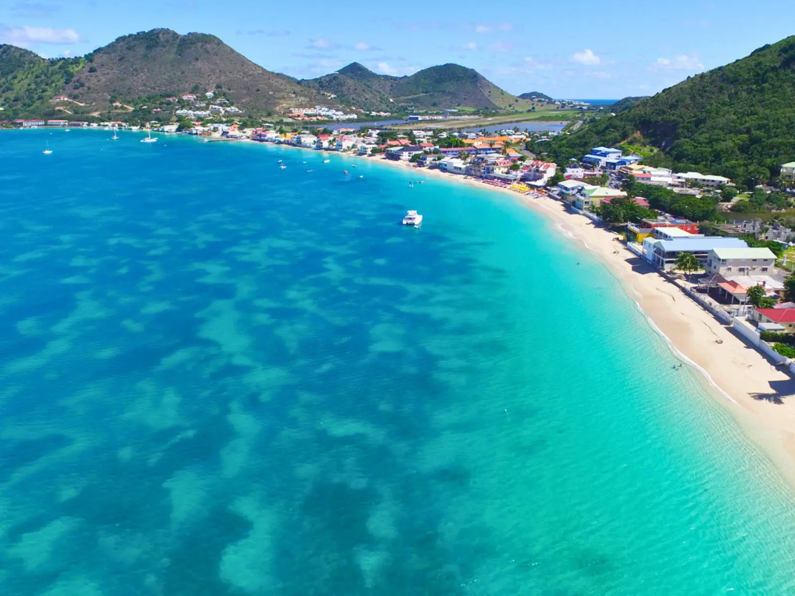 Aerial view of Grand Case beach and coastline in St Martin with turquoise water