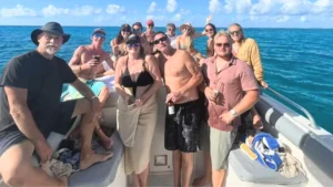 Mixed age group of guests enjoying a private boat charter in St Maarten