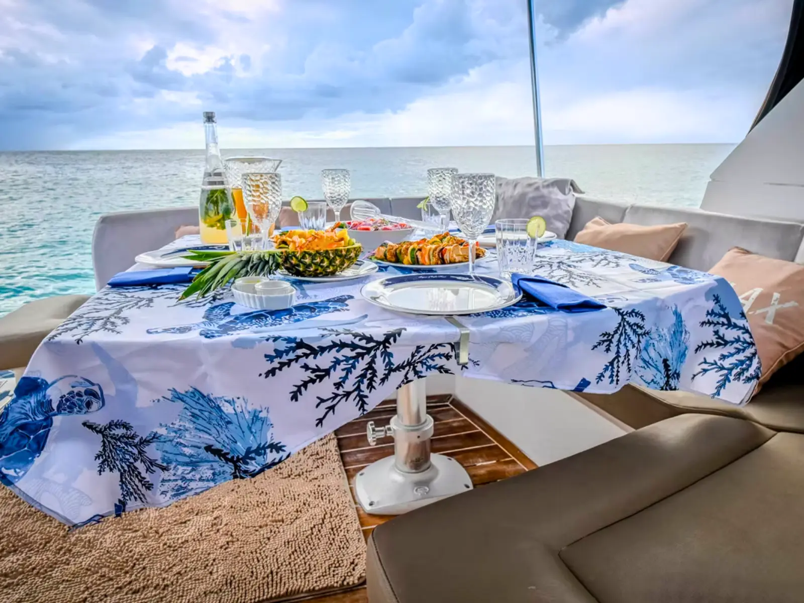 dining setup on luxury private yacht charter st maarten with ocean views and drinks on deck