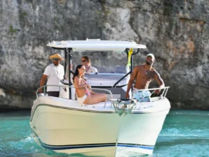 Guests relaxing at bow in St Barts on a private boat charter