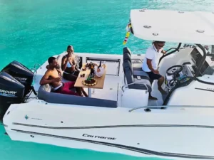 Guests dine aboard a private yacht charter in St Barts