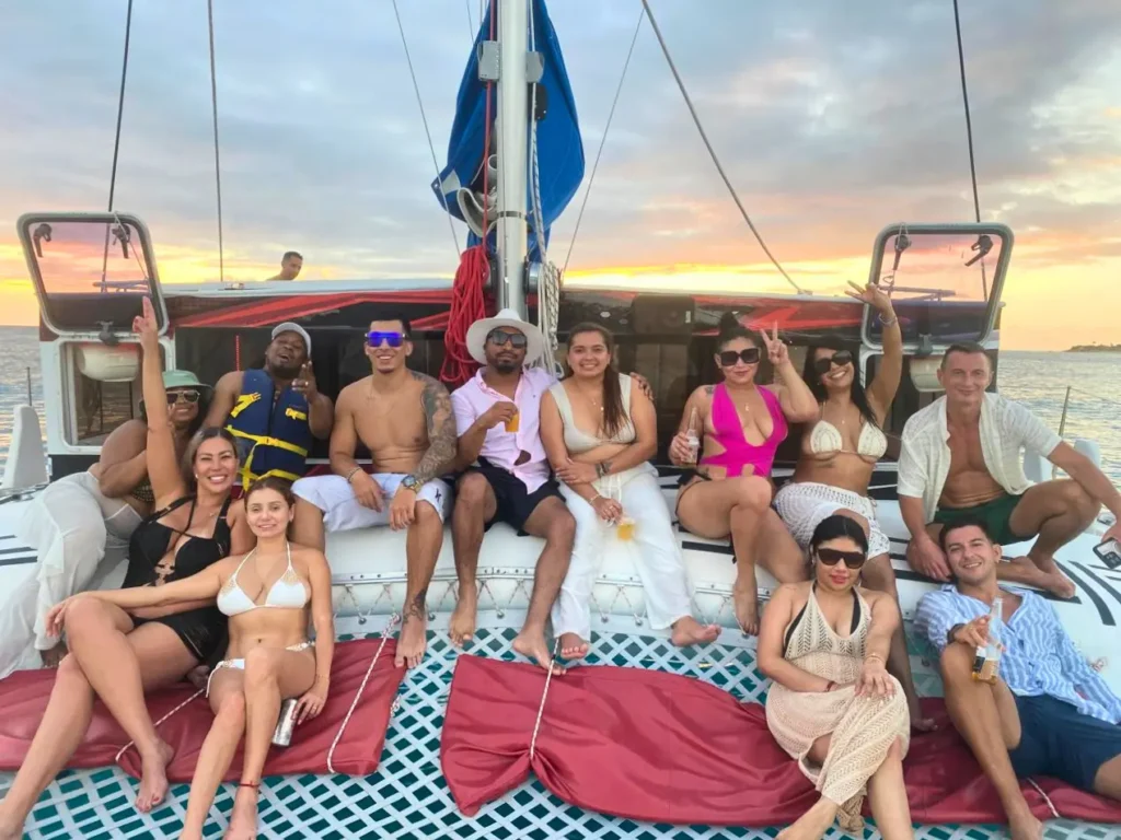 Friends enjoying a private sunset catamaran cruise in St Martin