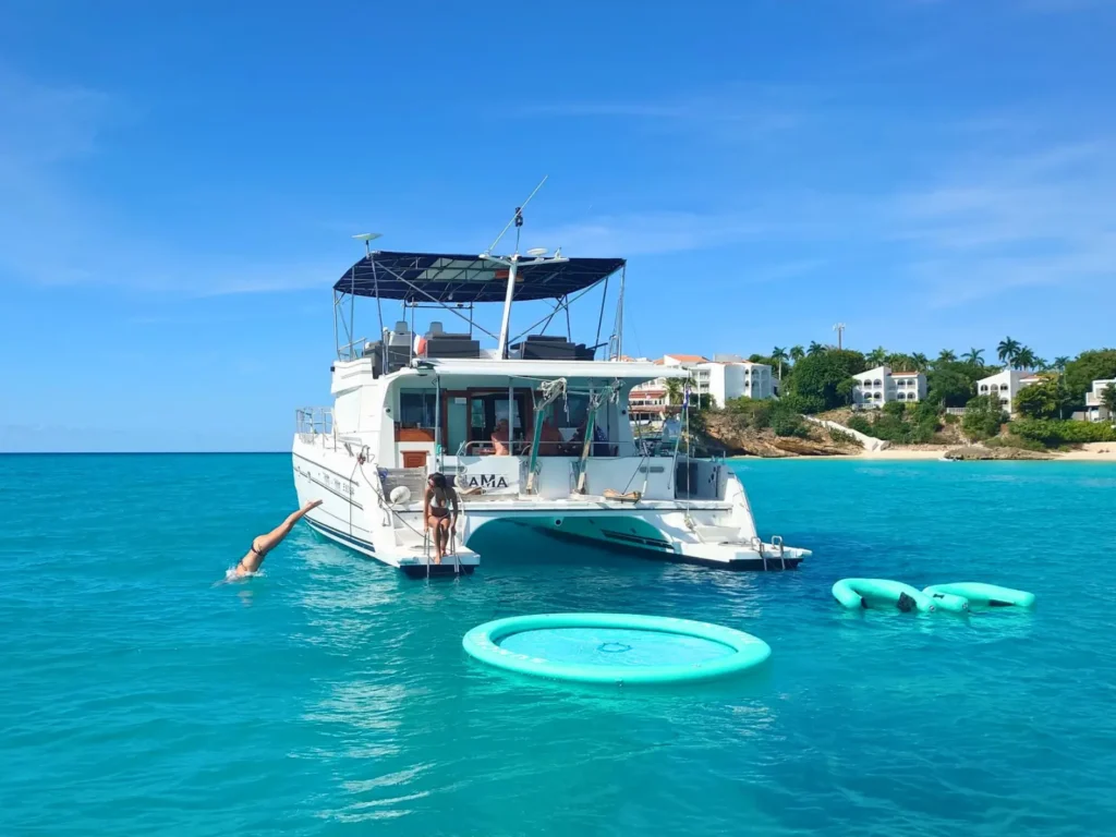 Spacious private power catamaran anchored in turquoise Caribbean water